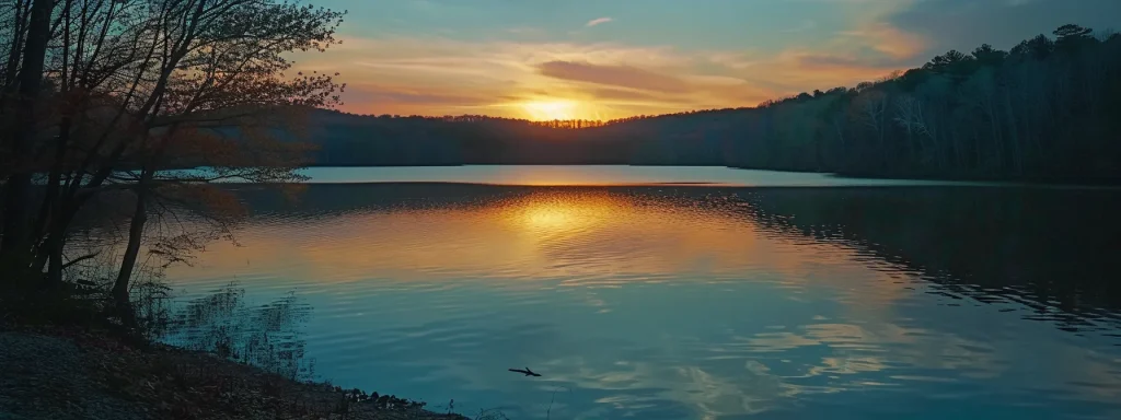 a scenic sunset over a tranquil lake with colorful reflections.
